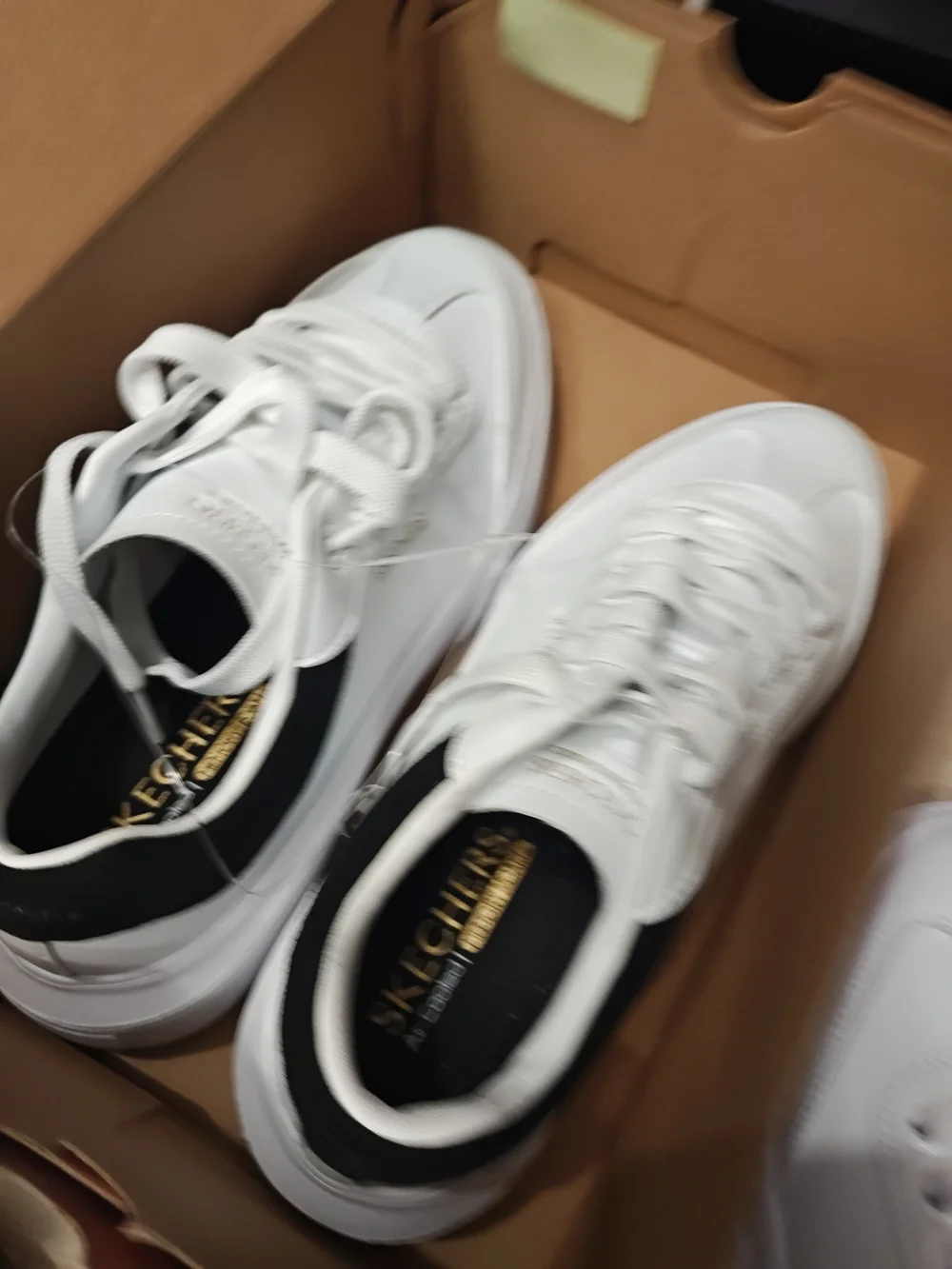 Skechers Men’s White Sneakers with Black Heel Accent 9